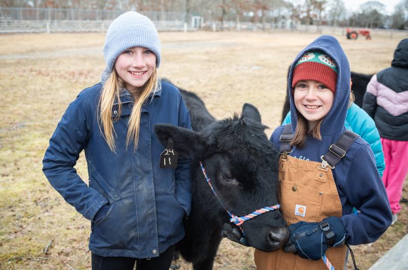 Leona Maloney and Juniper Begin with their bridled cows.