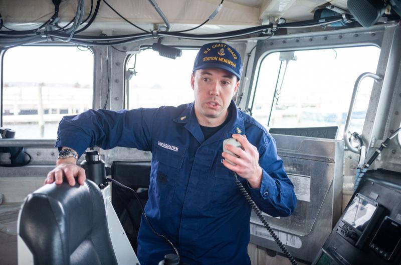 BM1 Tyler Vanderhaven in the cockpit of one of the Coast Guard vessels.