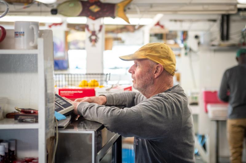 Stanley Larsen at work in Menemsha Fish Market.