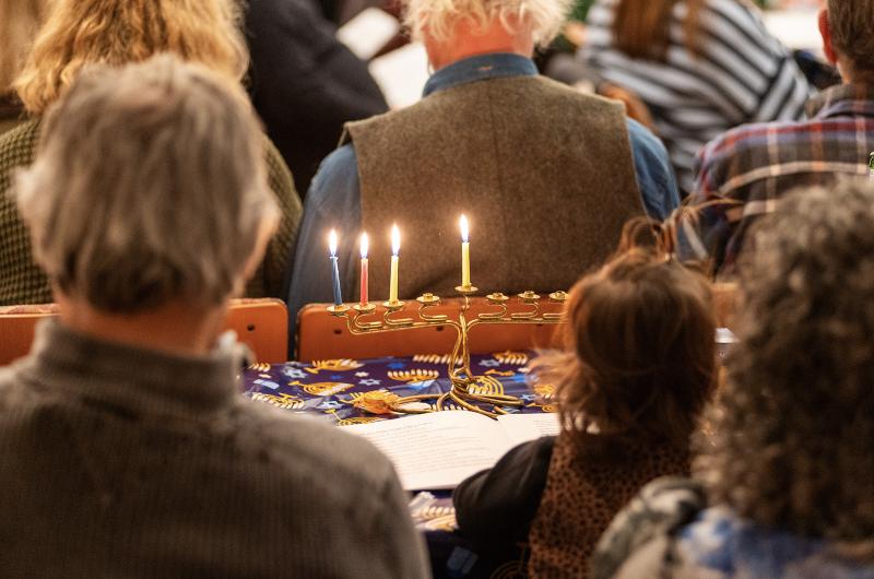 Members of The MV Hebrew Center gather for the third night of Hanukkah.